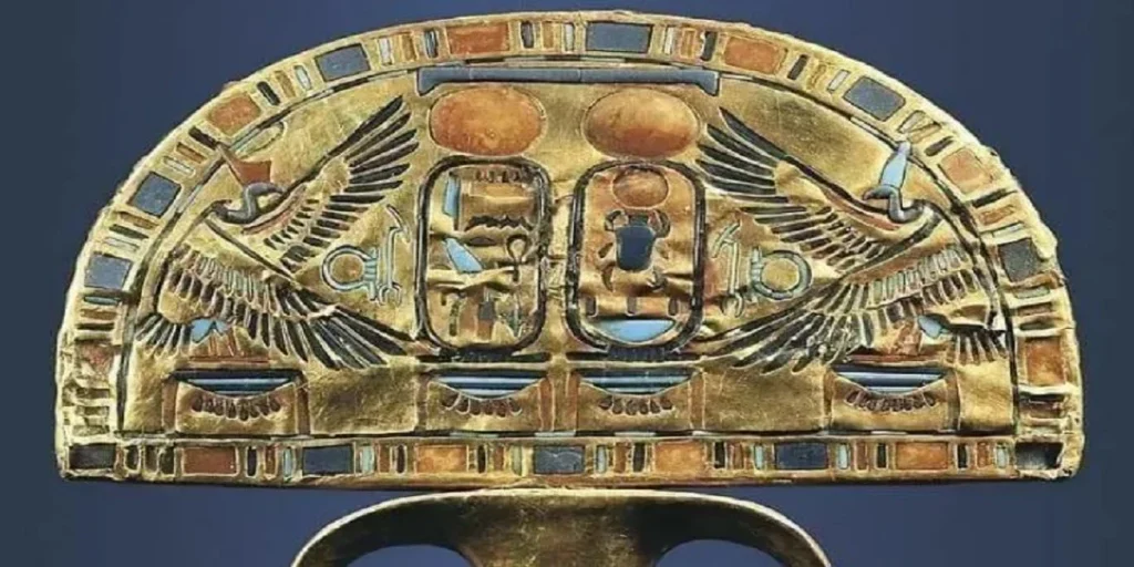 This ceremonial fan of Tutankhamun originally held ostrich feathers, it is made of wood covered with sheets of gold and inlaid with colored glass, turquoise, lapis lazuli, carnelian, and translucent calcite.

